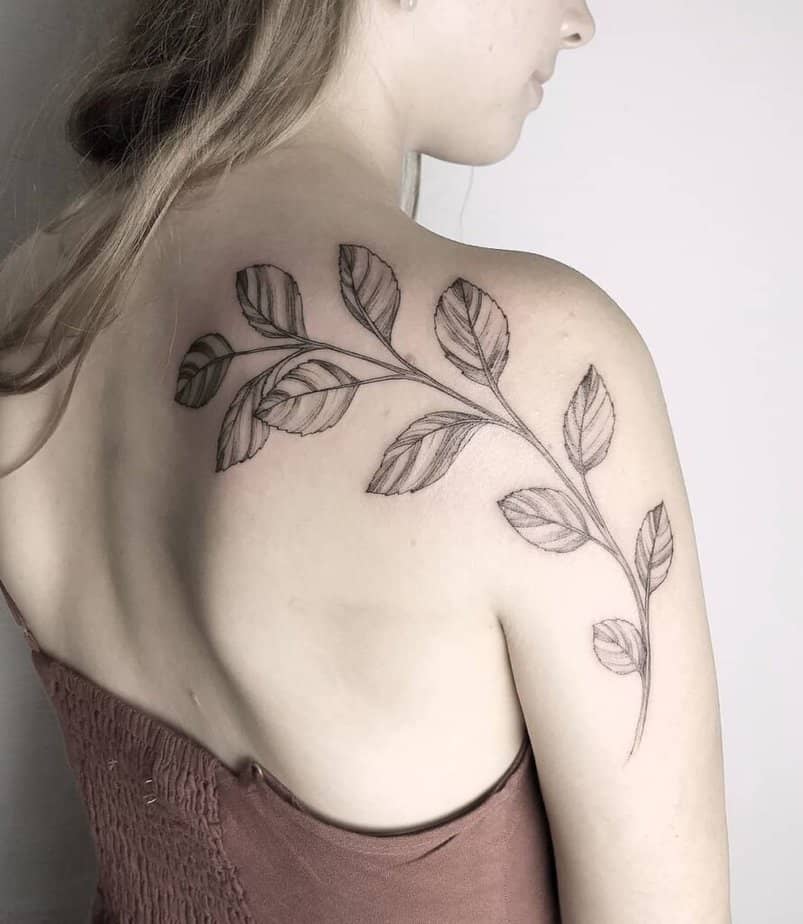 12. A tattoo of apple tree leaves scattered across the shoulder