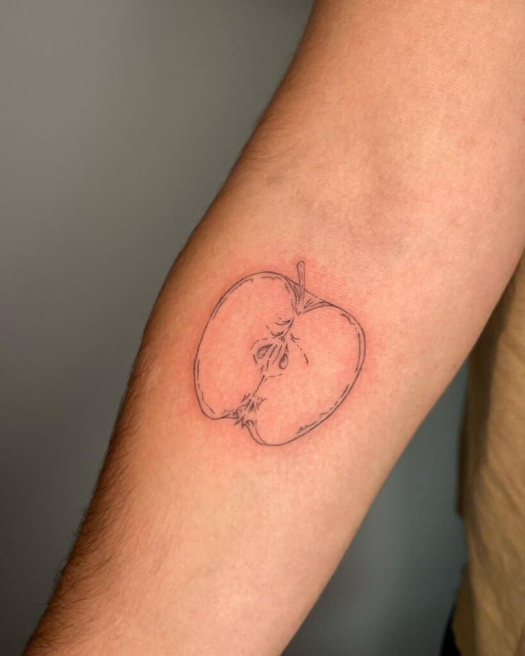 15. An apple tattoo