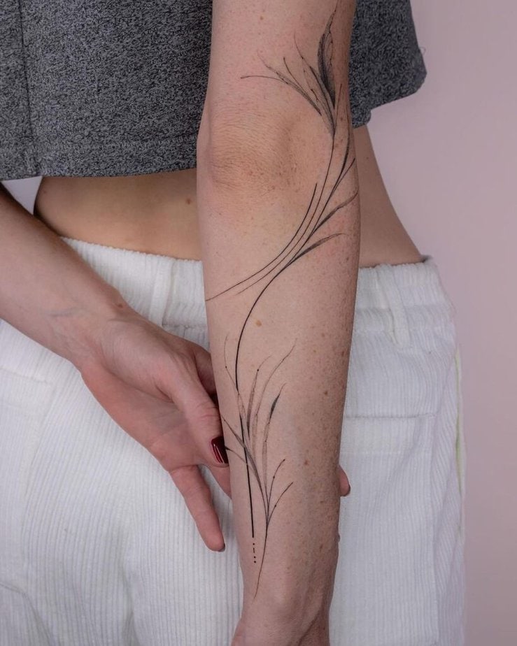 Flowy leaves forearm tattoo