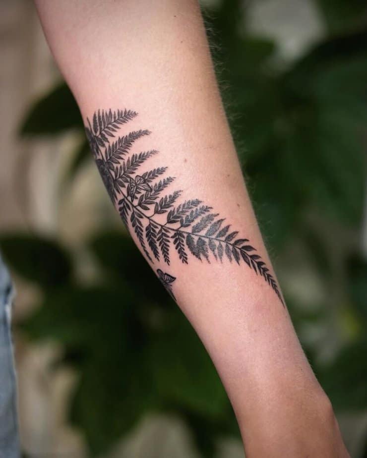 Silver fern forearm tattoo