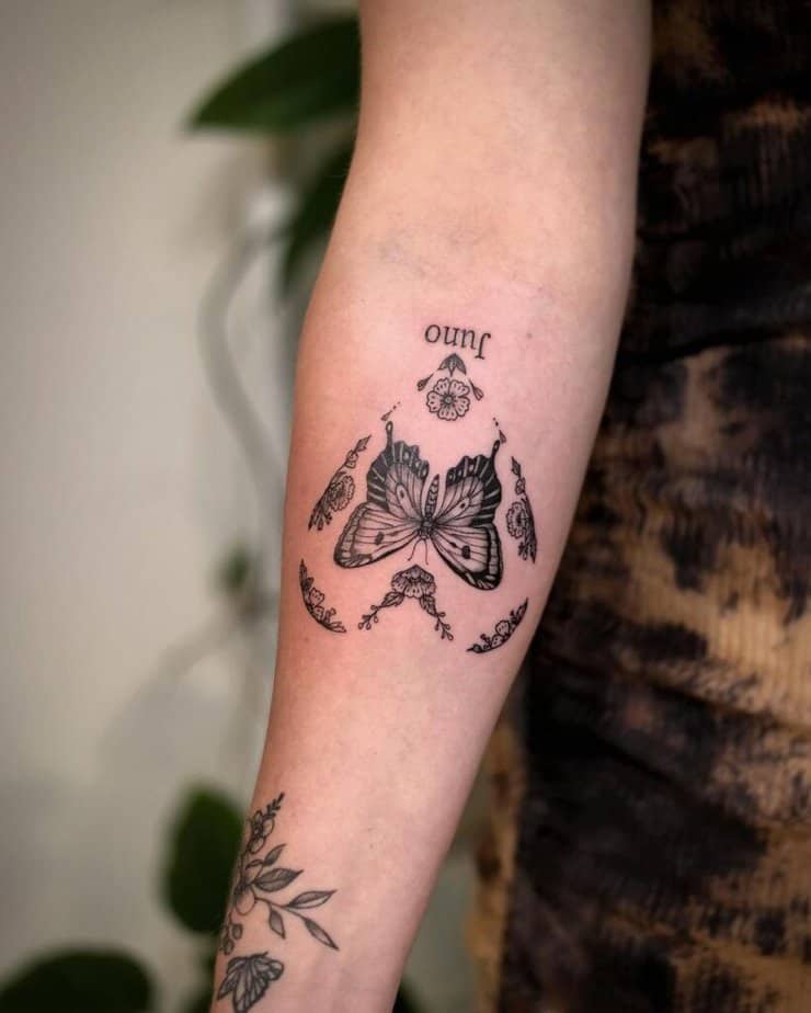 Butterfly forearm tattoo