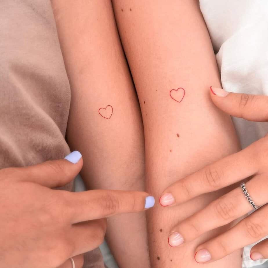 Matching heart forearm tattoo