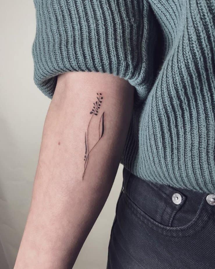 Linework botanical tattoo on forearm