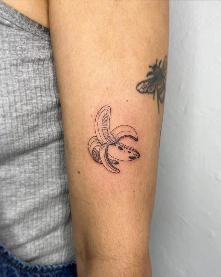 1. A fine-line banana tattoo