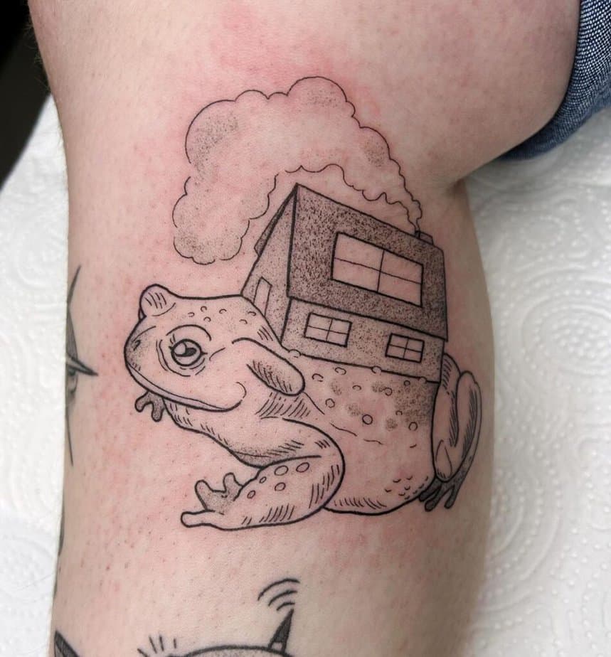 Black and gray frog tattoo