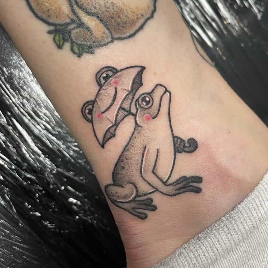 Black and gray frog tattoo