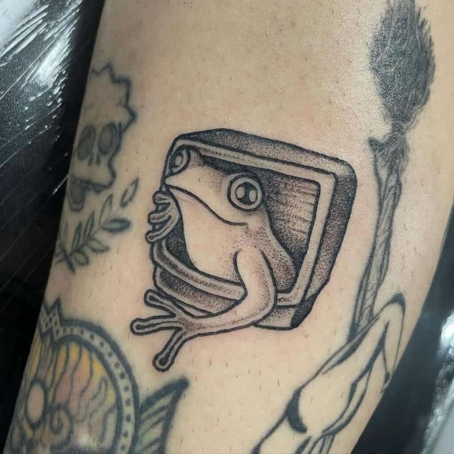 Black and gray frog tattoo