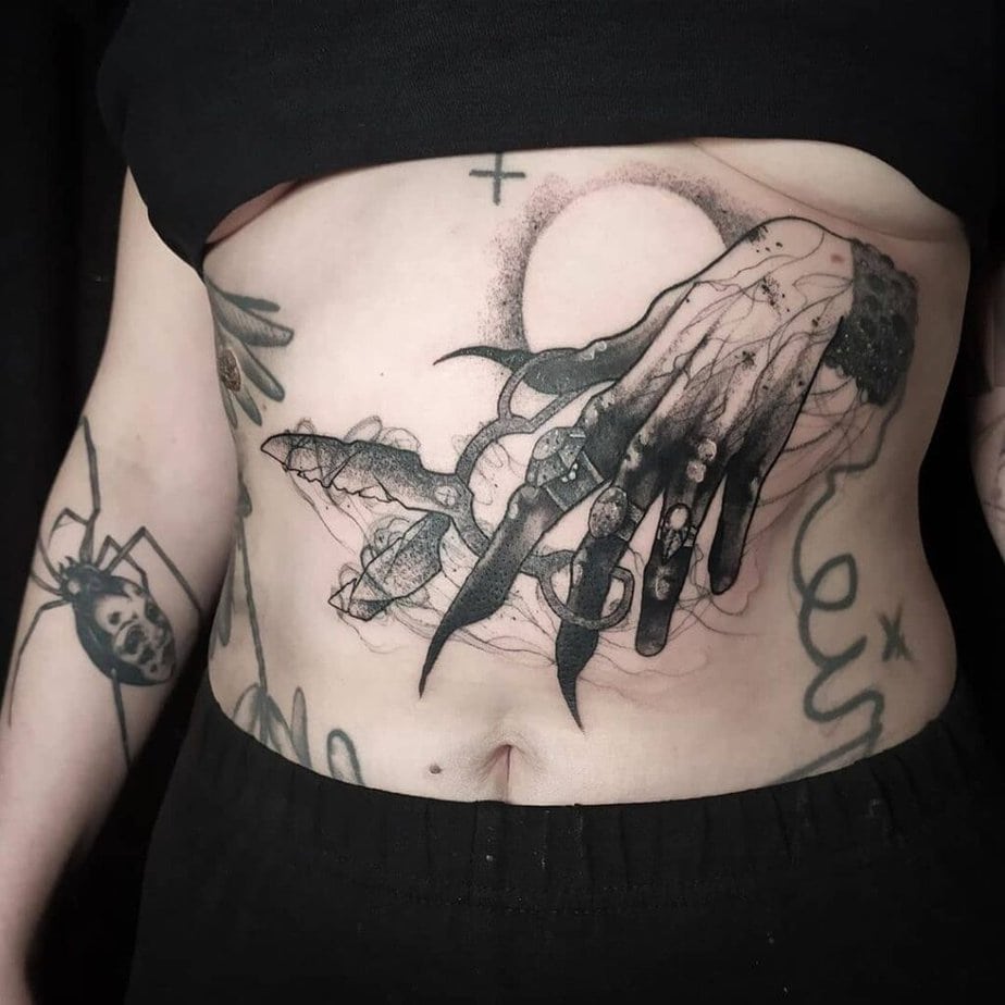 Spooky witch hands tattoo