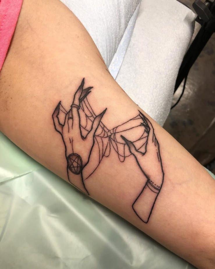 Simple witch hands tattoo