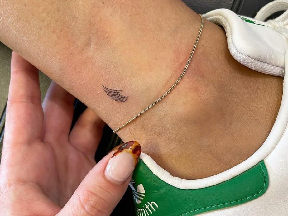 10. A small ankle tattoo a wing 