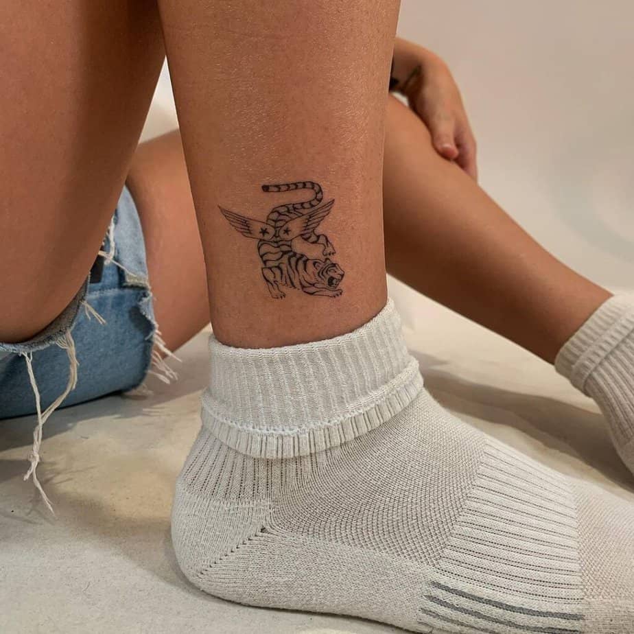 16. A tiny tiger tattoo 