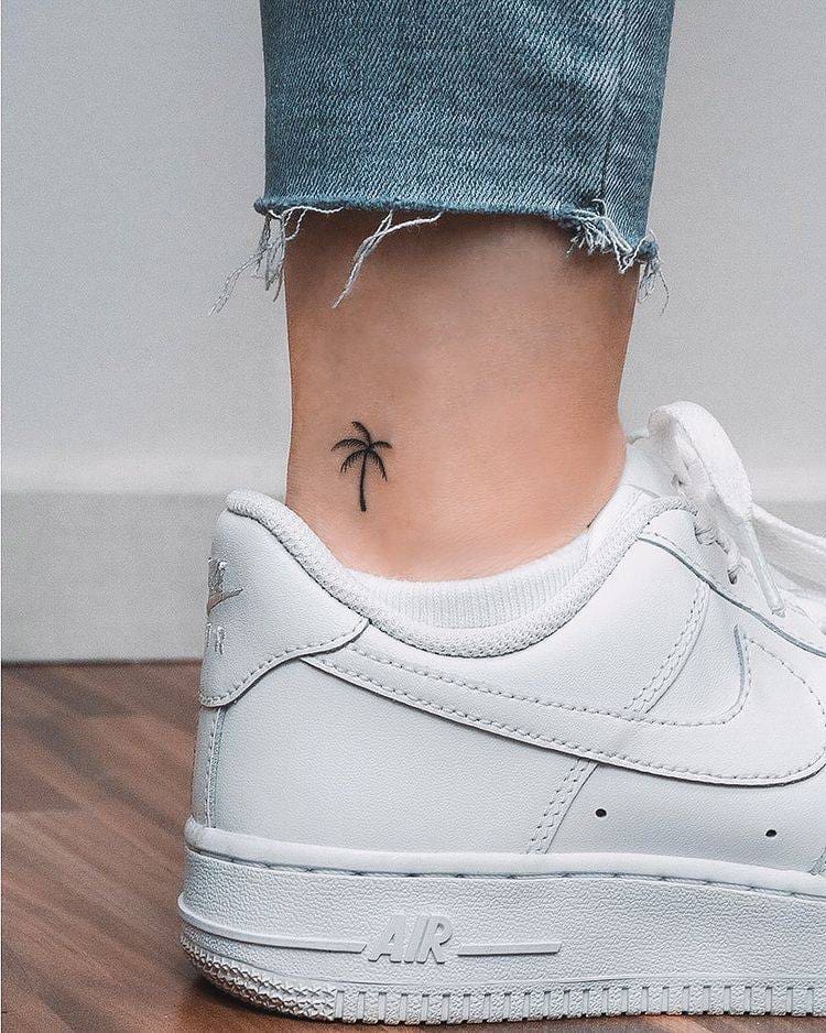 2. A tiny palm tree tattoo 