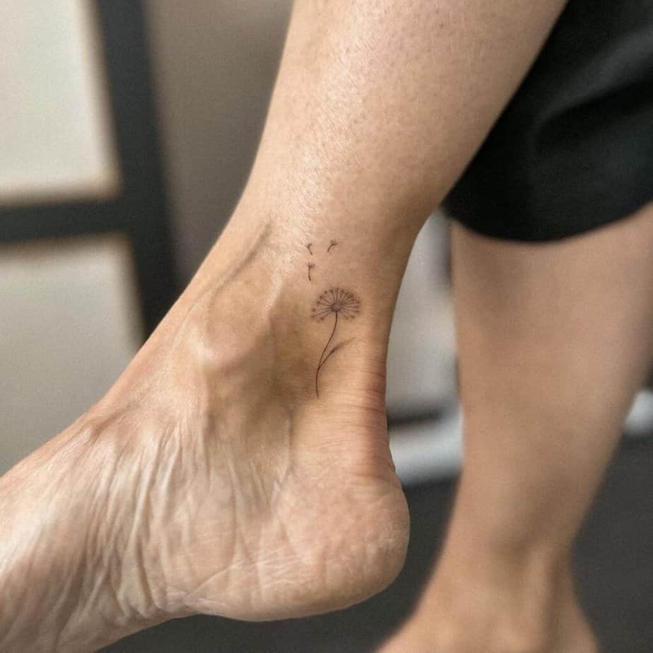 24. A delicate dandelion tattoo 