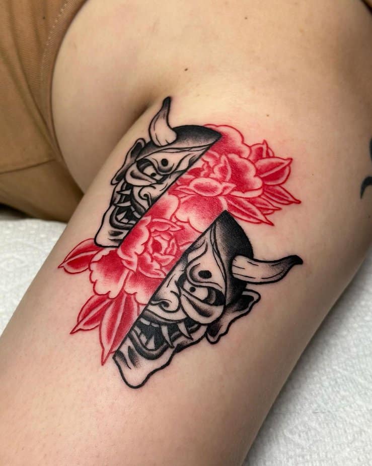 Hannya mask paired with vibrant red flowers