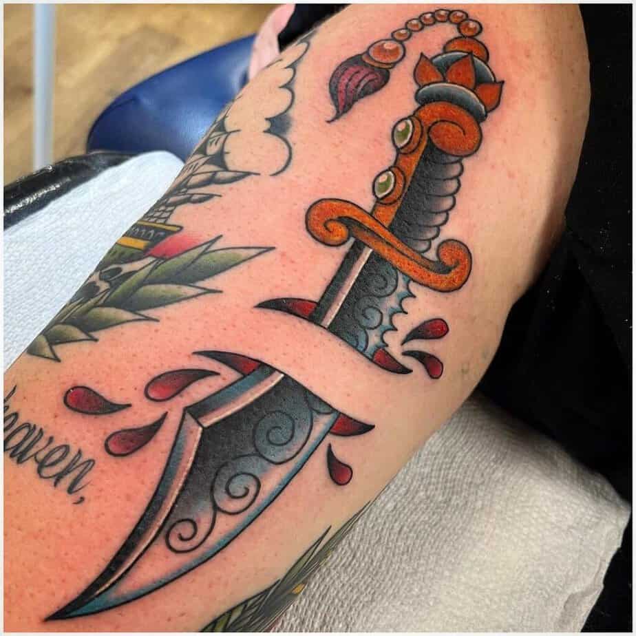 Color traditional dagger tattoo