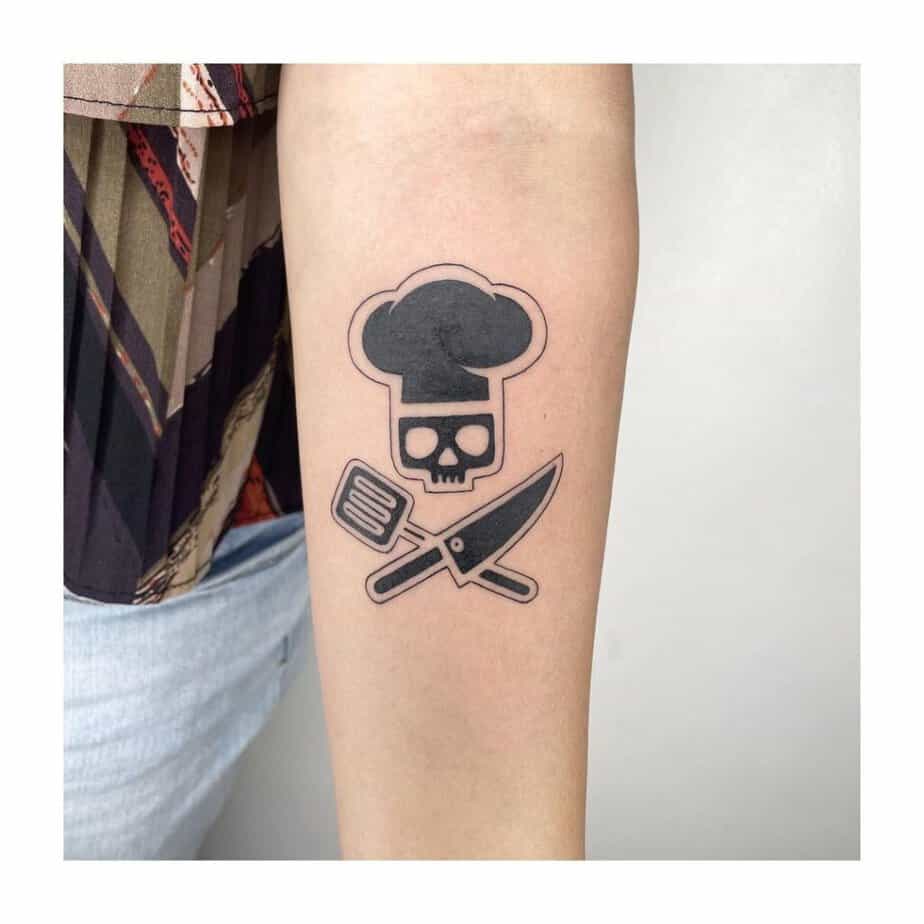 11. A blackwork chef tattoo
