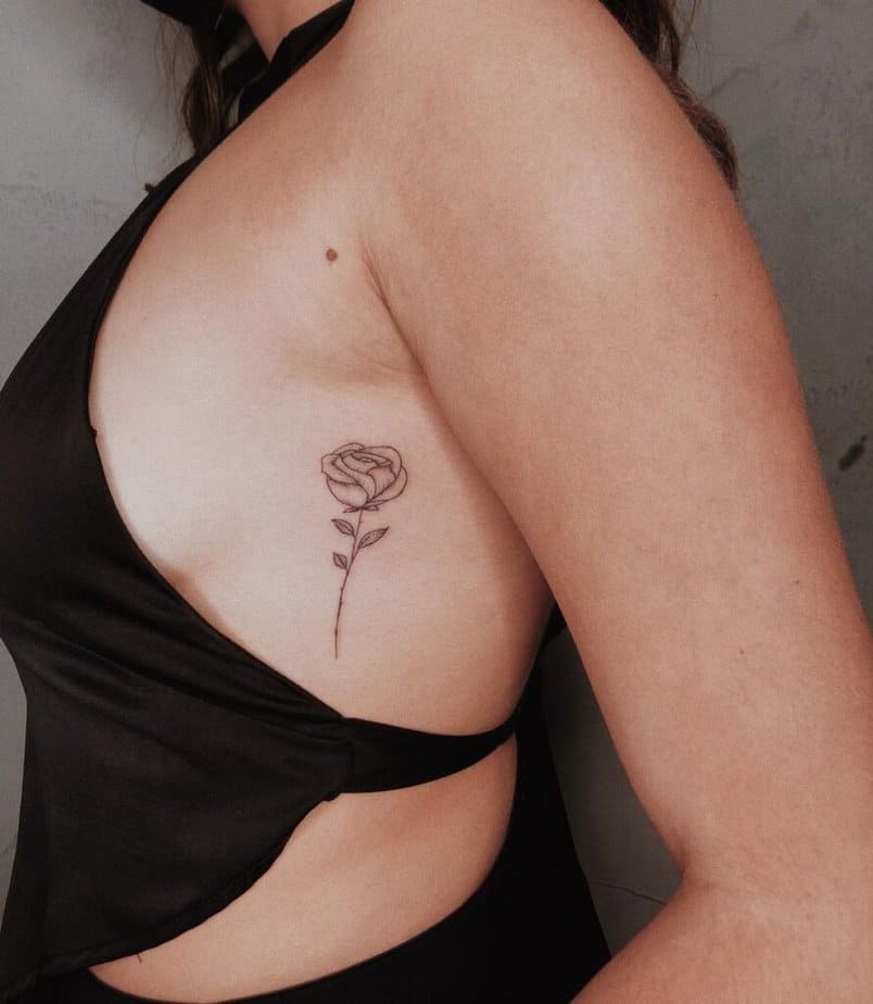 Rose tattoo on the rib