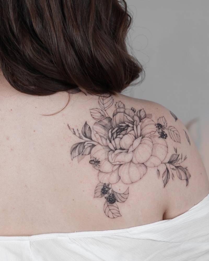 Delicate floral shoulder tattoo