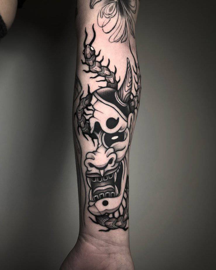 Hannya mask with a centipede crawling over it