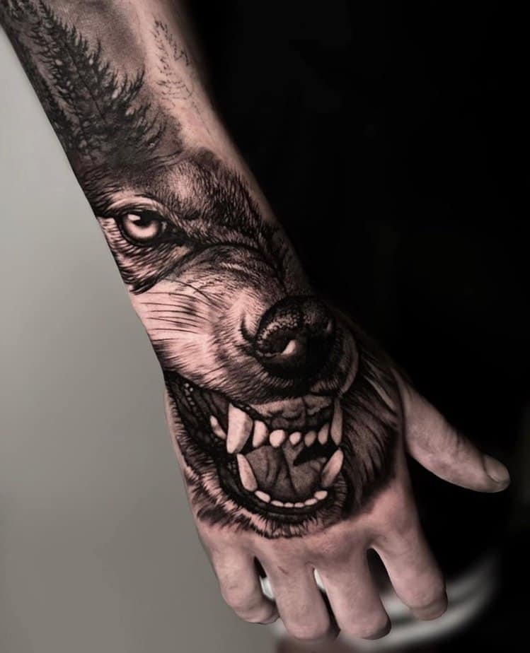 Hand wolf tattoo