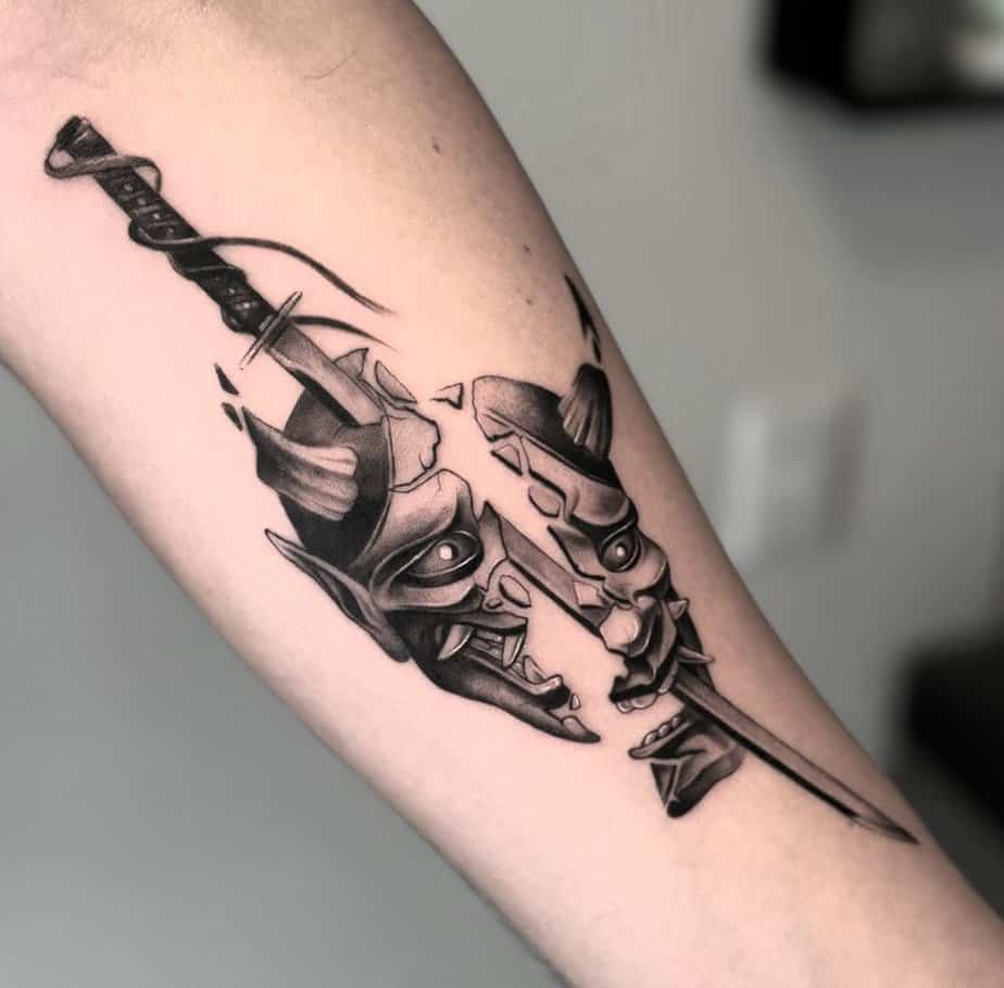 Hannya mask split by a blade, signifying struggle and survival