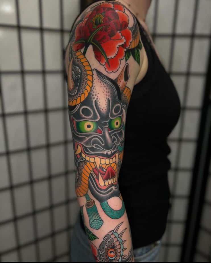 Full sleeve combining Hannya mask with intricate floral elements