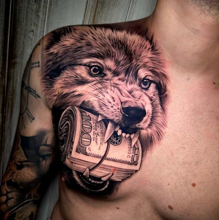 Wolf biting cash tattoo