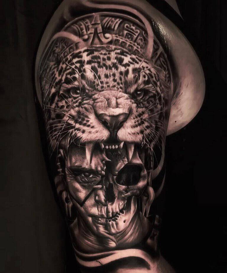 Intense Aztec jaguar and skull arm tattoo