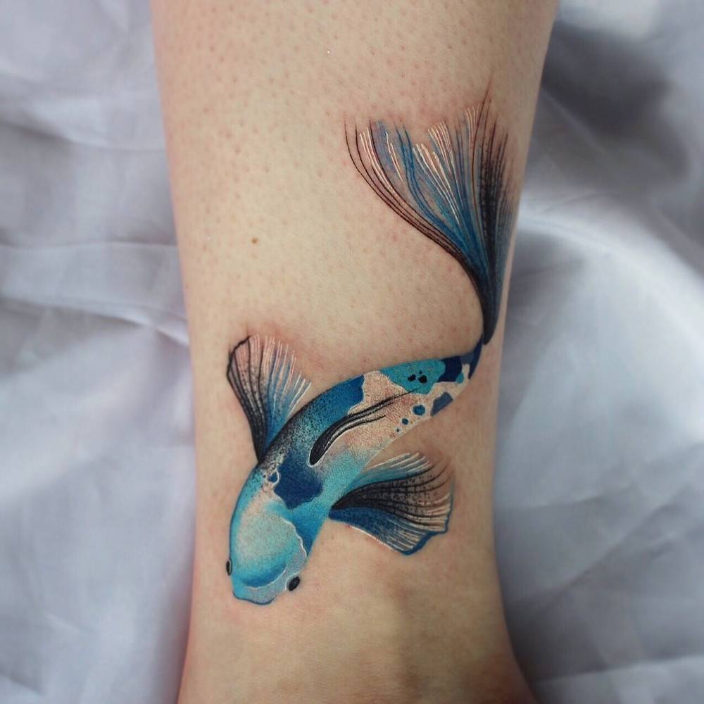 Colorful koi fish tattoo with flowing fins