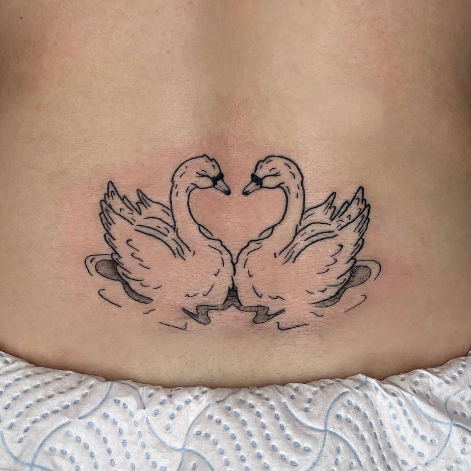 Swans in love tattoo