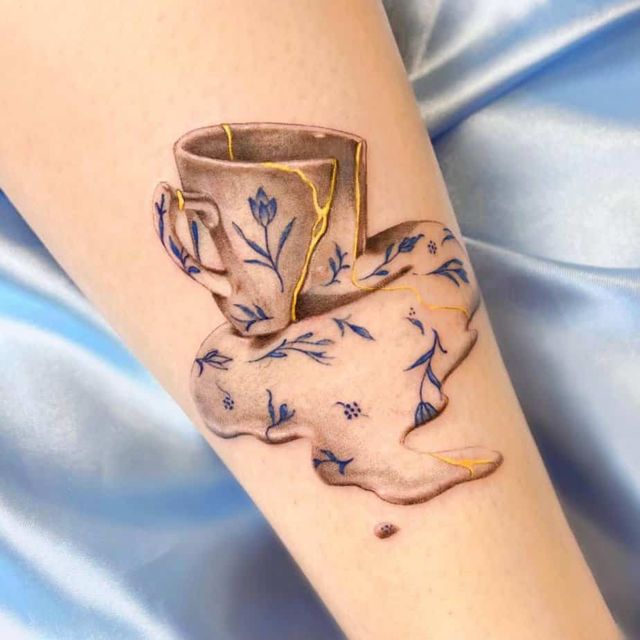 Spilled teacup with kintsugi-inspired cracks