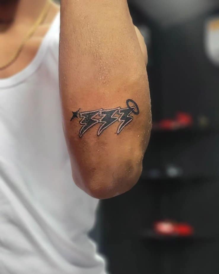 Badass 333 tattoo on elbow