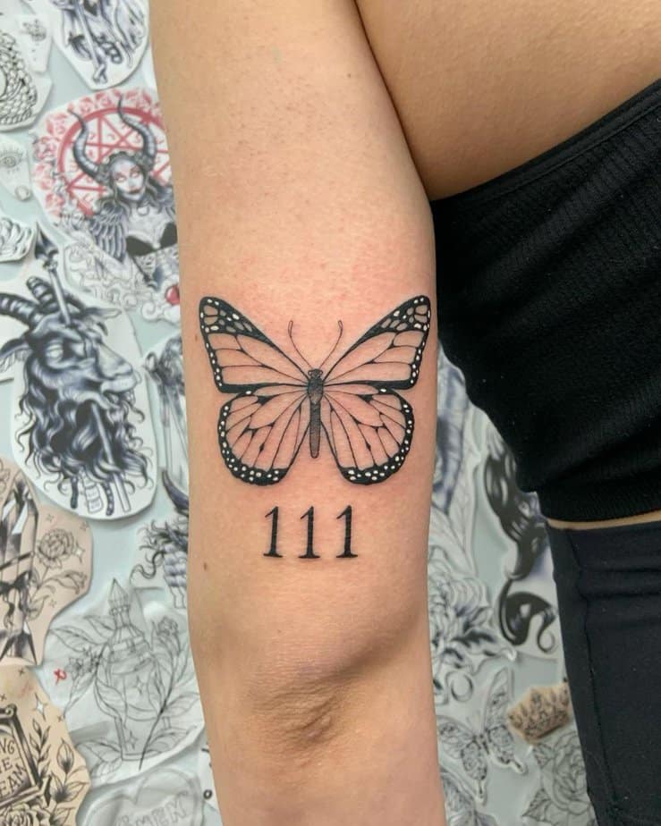 Elegant butterfly and 111 tattoo