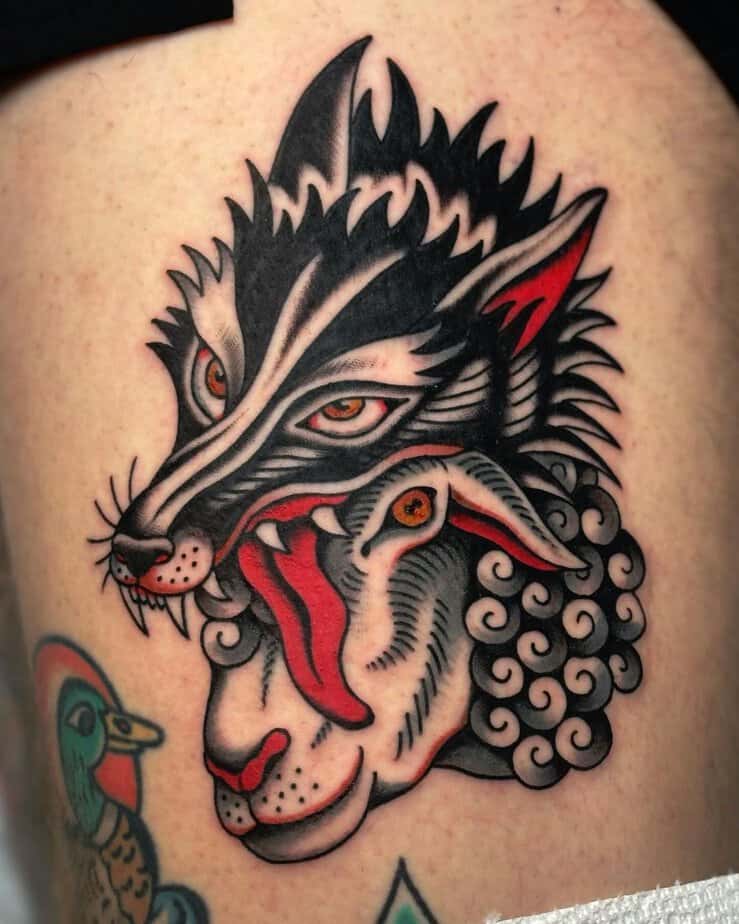 Two-faced wolf tattoo