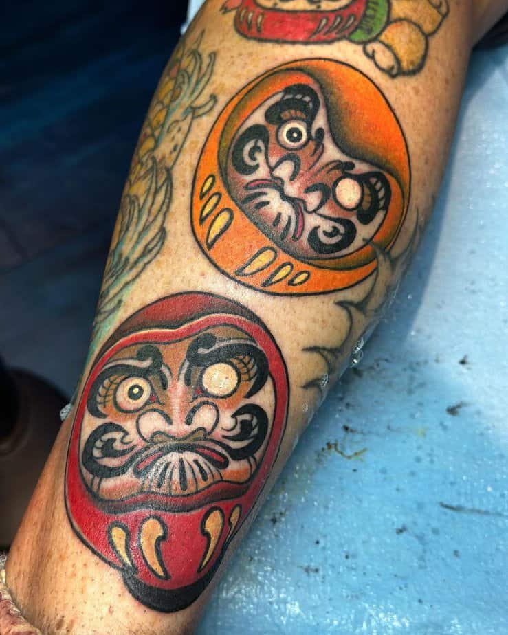 8. Red-and-orange-daruma-tattoos