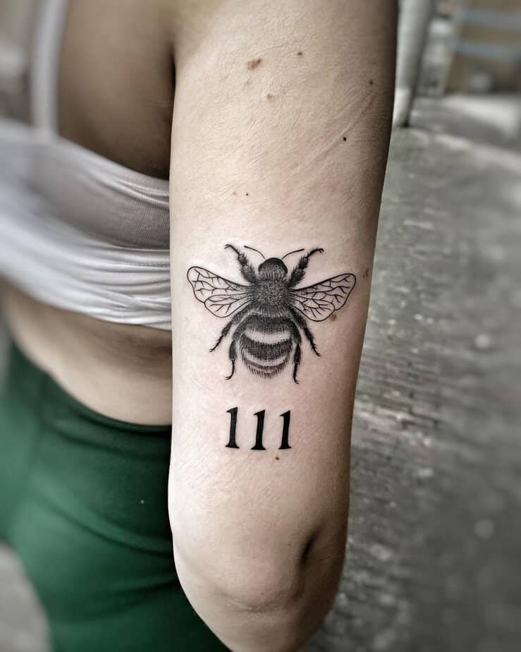 Buzzing bee and 111 tattoo
