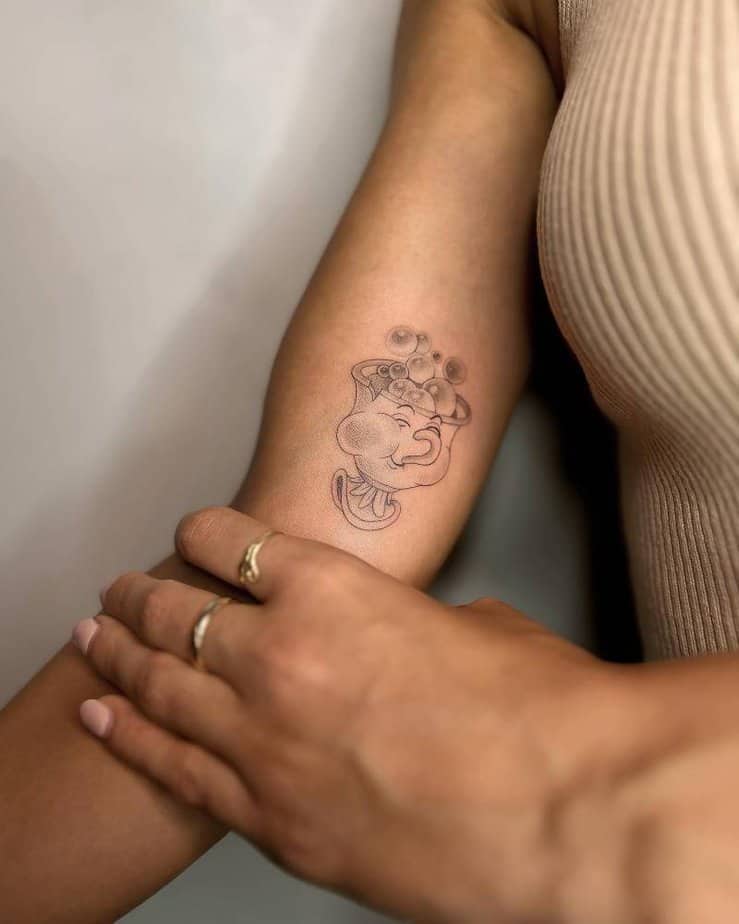 Cute Chip teacup tattoo with bubbly expression