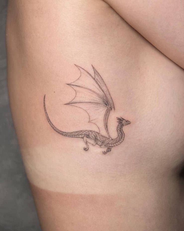 Small dragon tattoo on the side