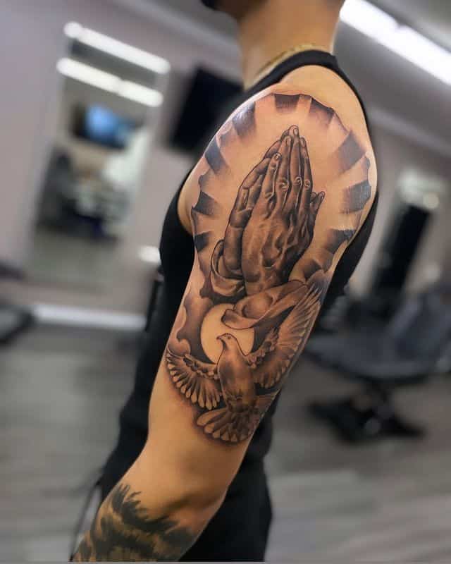 A dove and praying hands