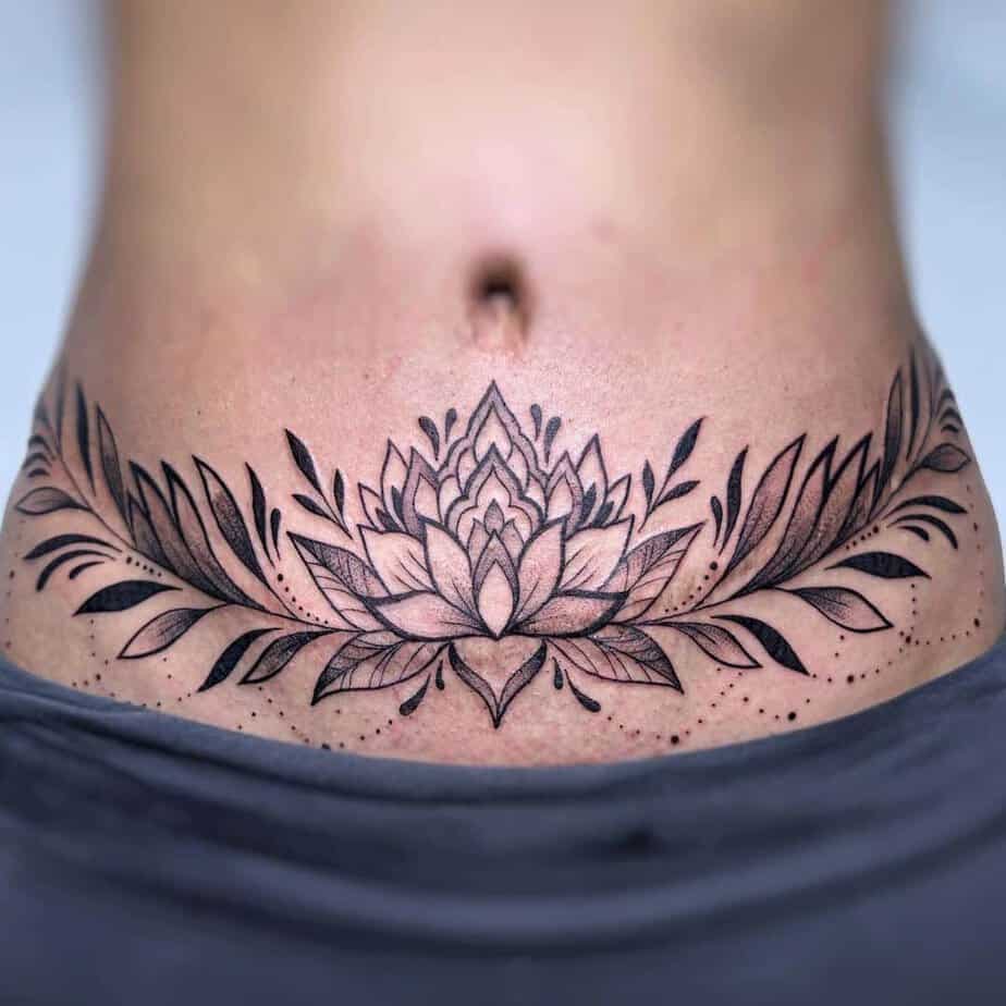 1. A lotus flower tummy tuck tattoo