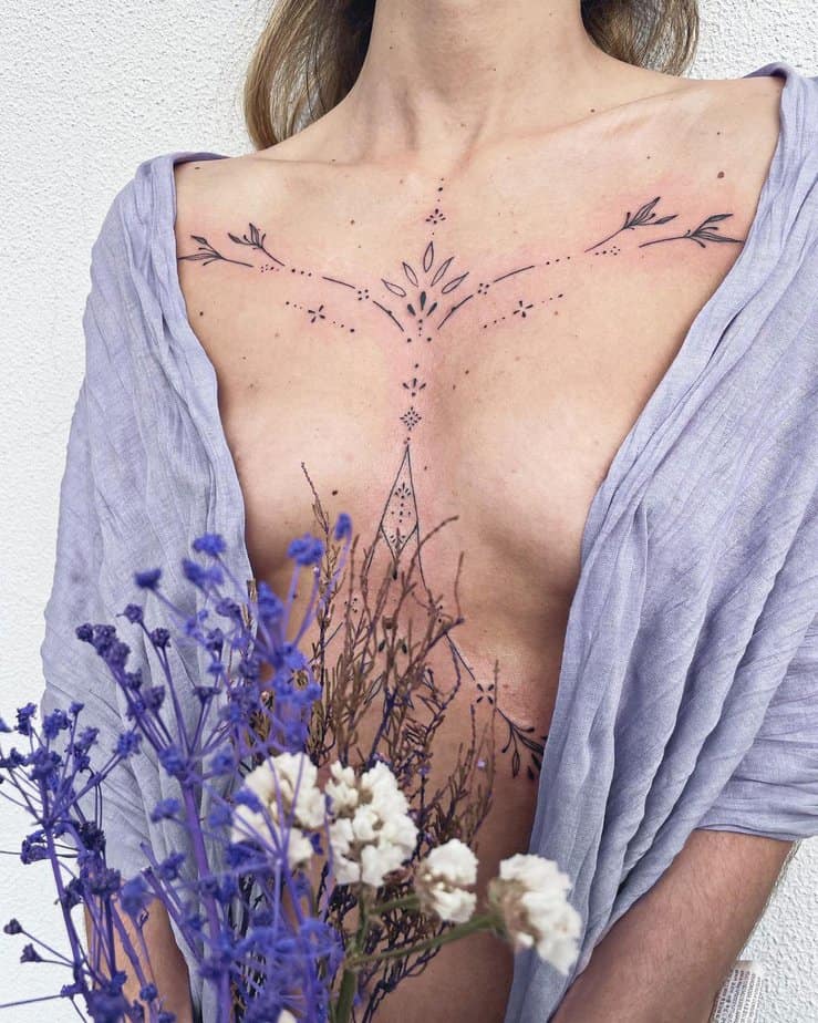 A statement ornamental sternum tattoo