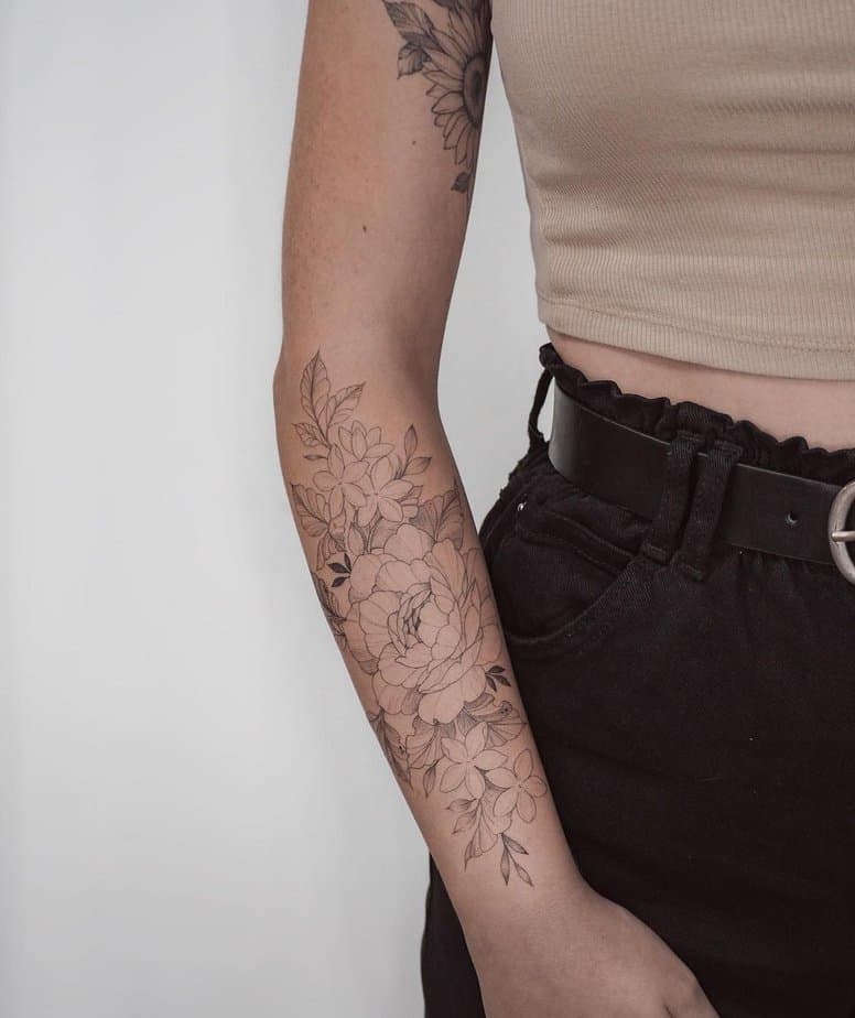 14. A tattoo of a pretty peony and jasmine