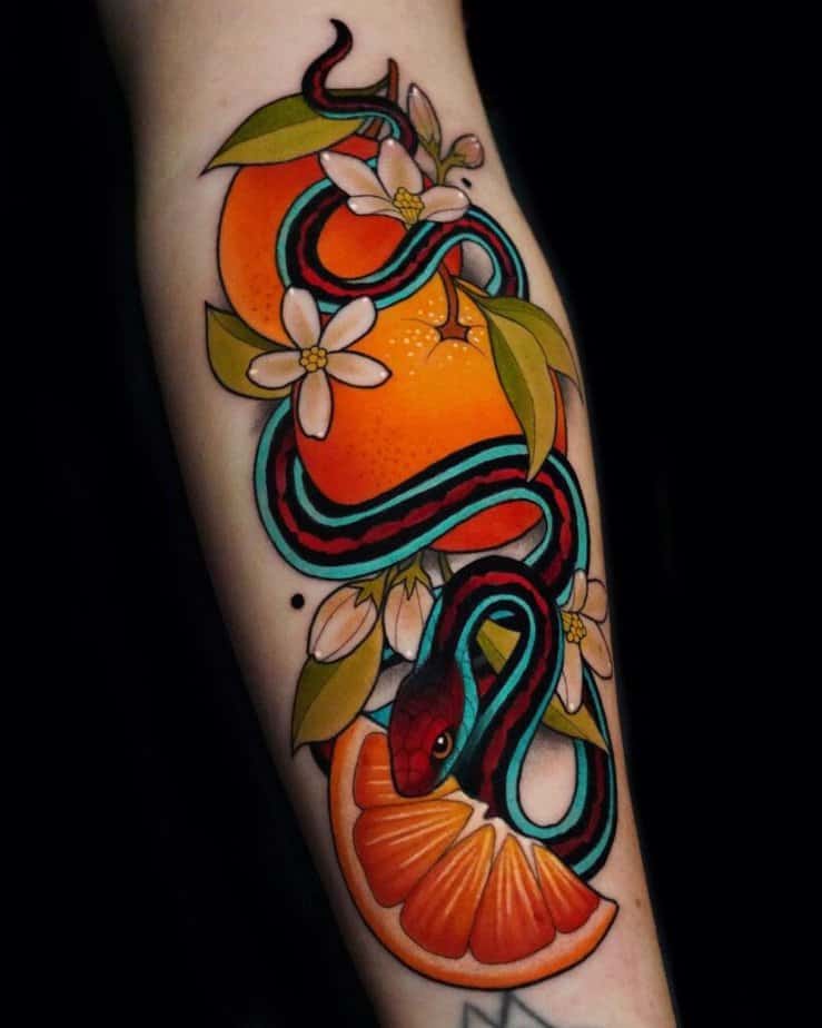 Colorful snake and flowers tattoo