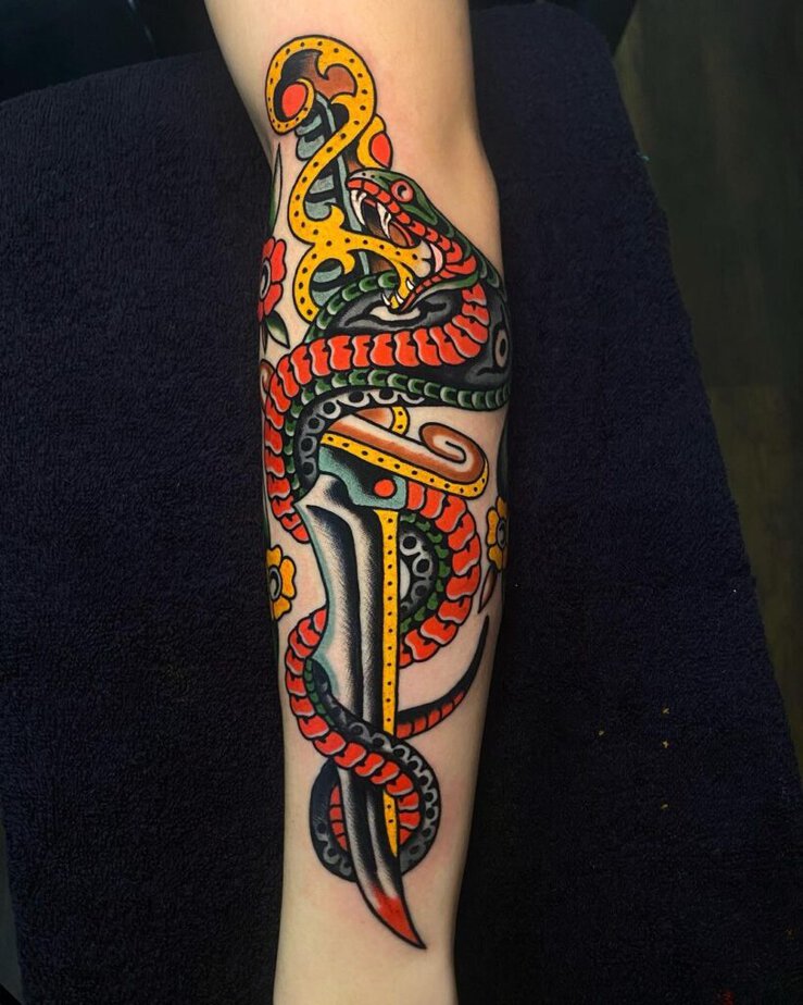 Colorful snake and flowers tattoo