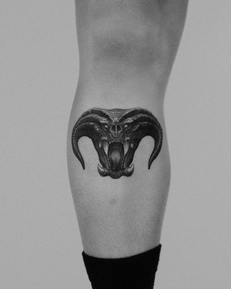 Small Balrog tattoo with fiery tendrils