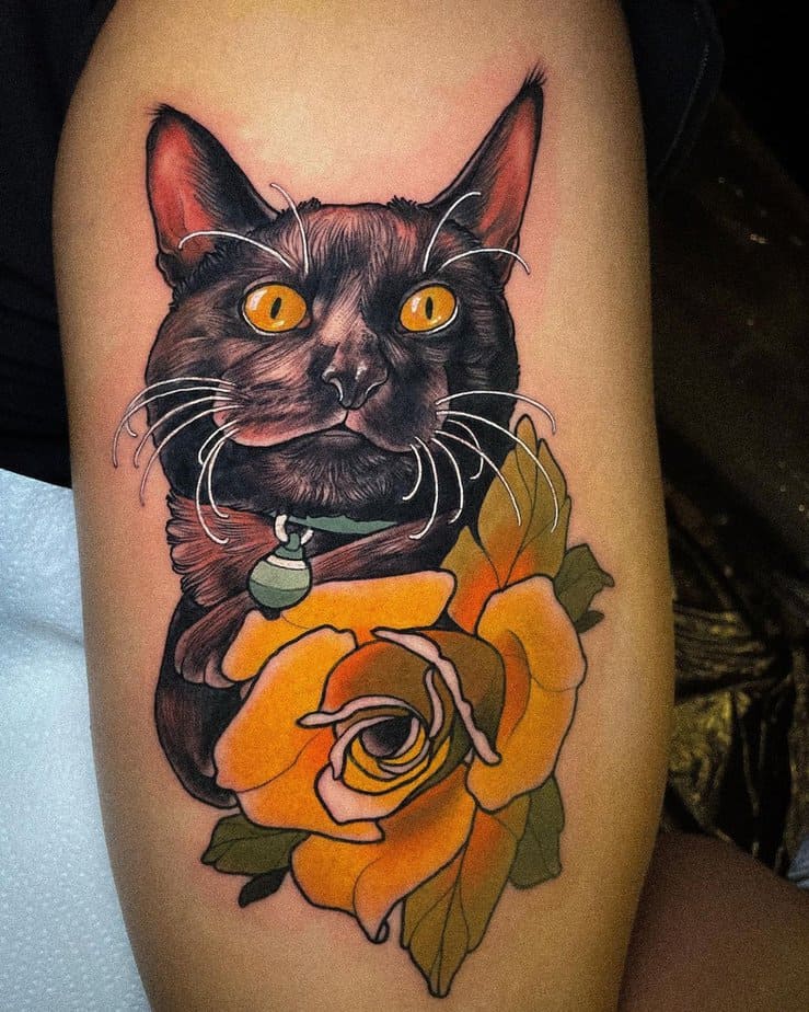 Black cat with a yellow rose