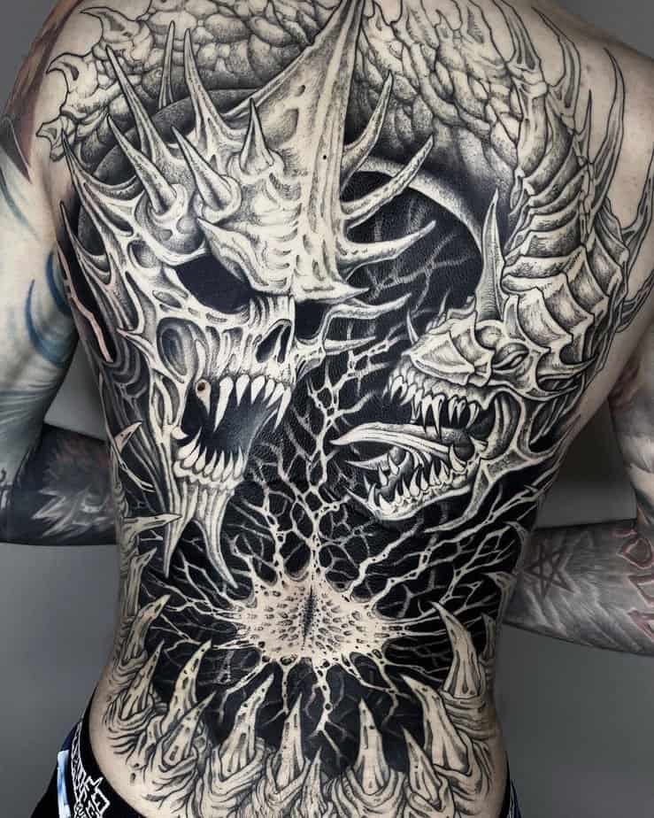 Large back-spanning Lord of the Rings tattoo full of dark, intricate imagery