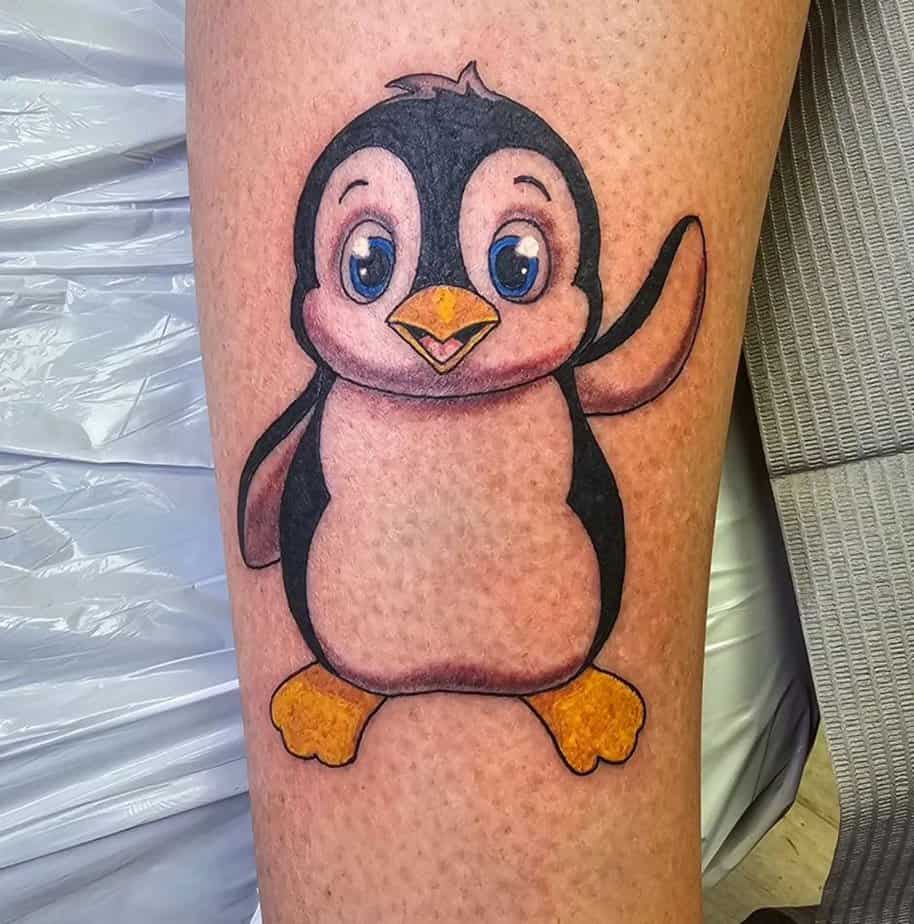 Cartoon-like penguin tattoos