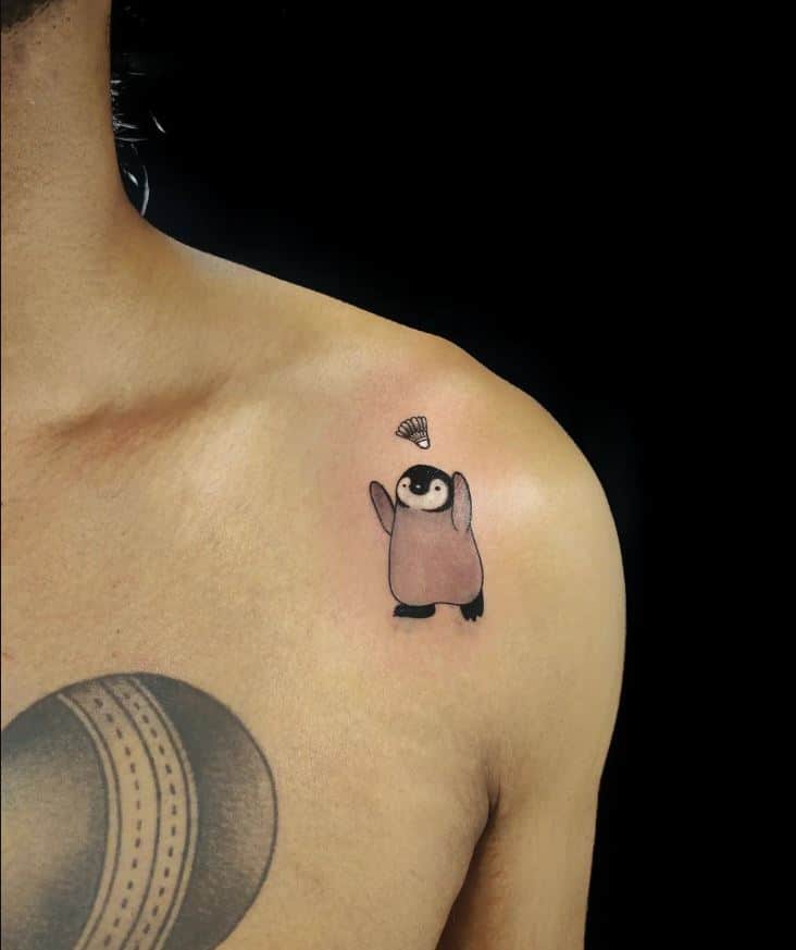 Cartoon-like penguin tattoos 1