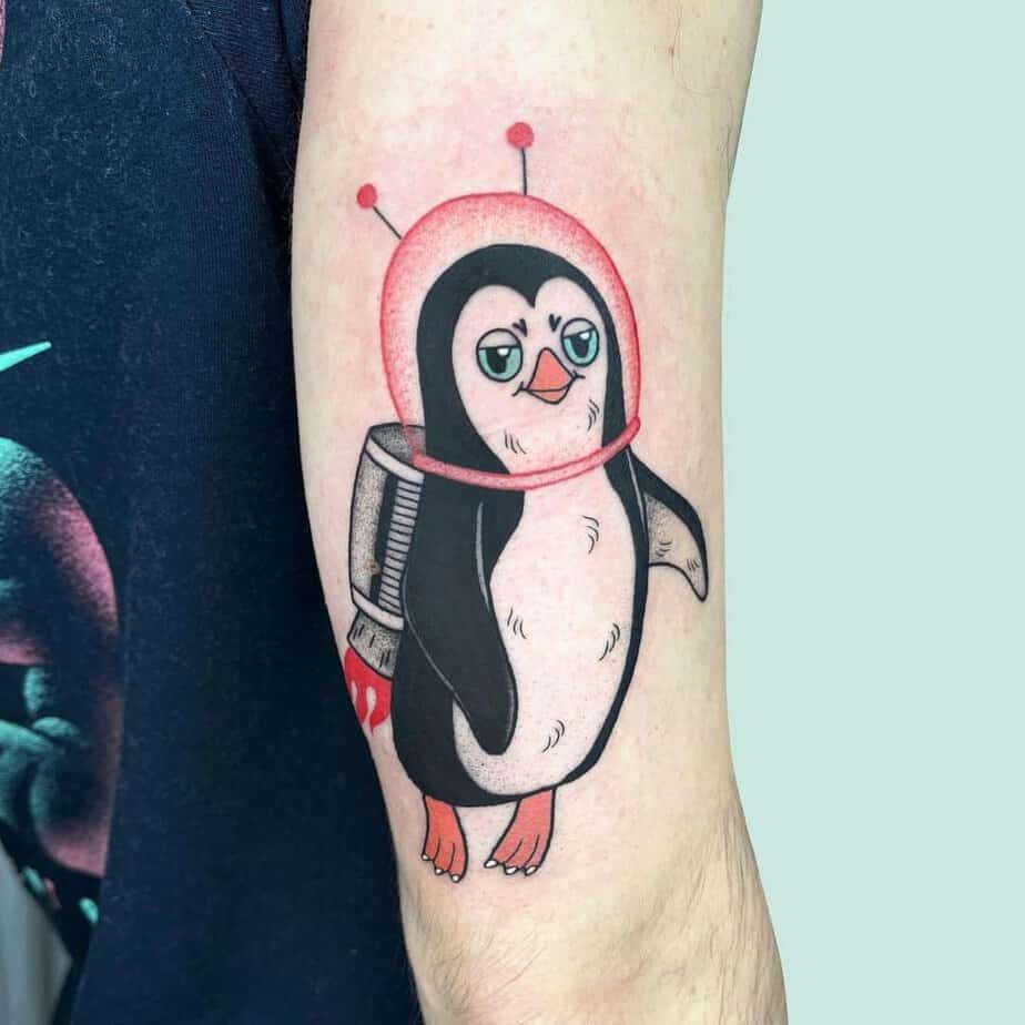 Cartoon-like penguin tattoos 6